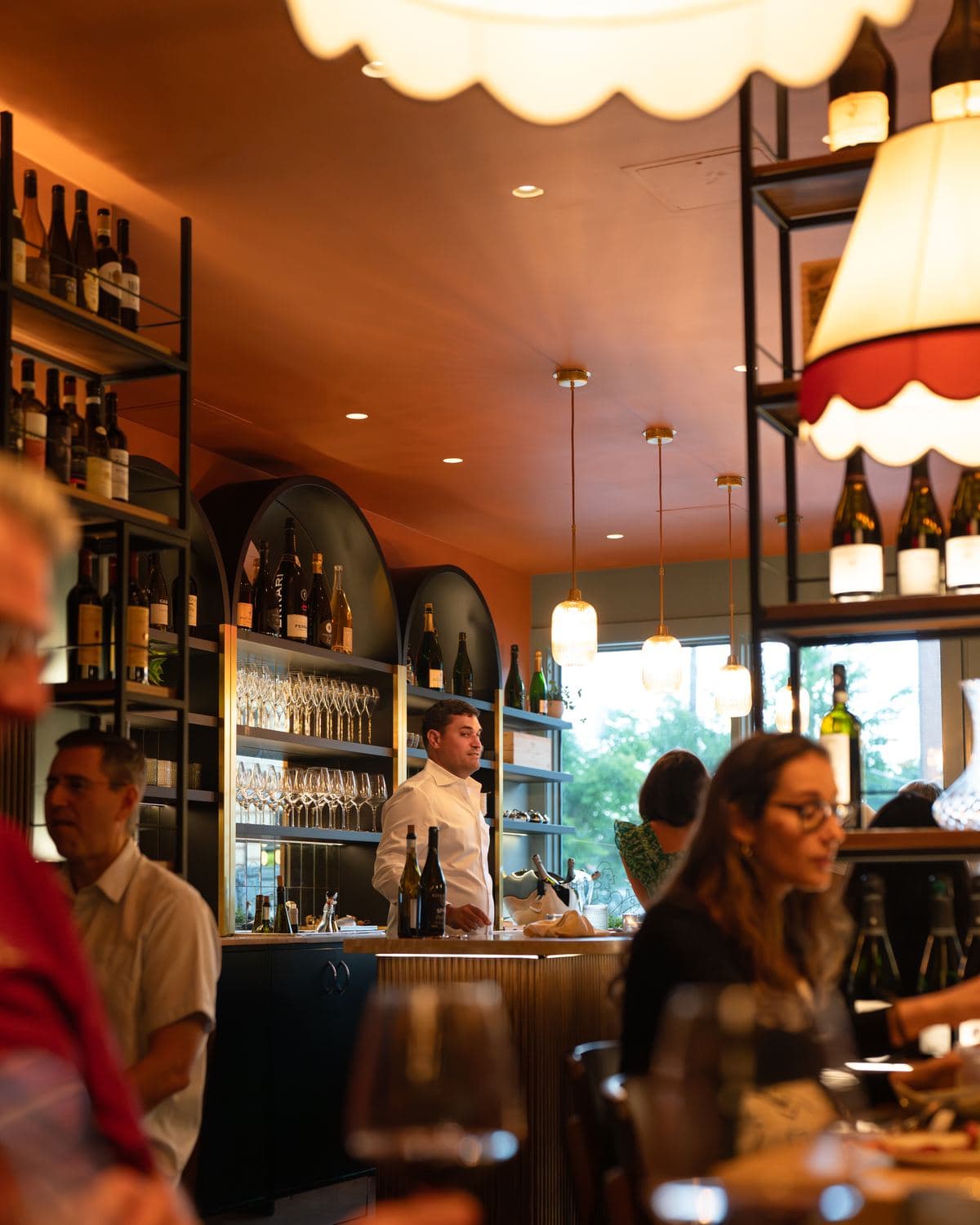 The bar in service, under the shaded pendant lamps